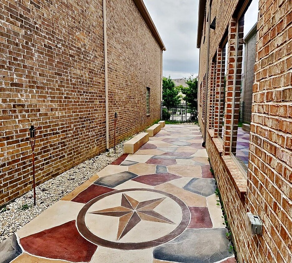 The private side yard with a Texas Star stamped-concrete patio