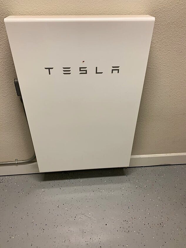 Tesla Powerwall mounted in the garage