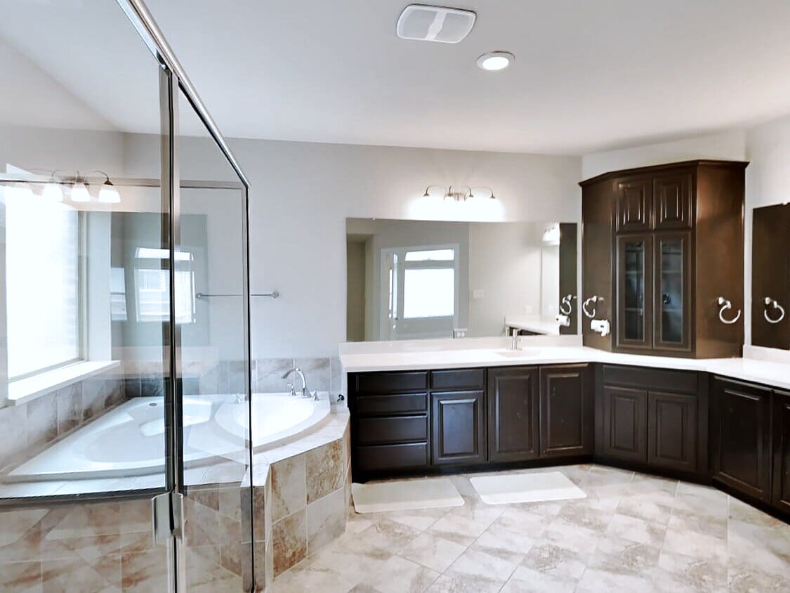 Master bathroom with garden tub and glass walk-in shower